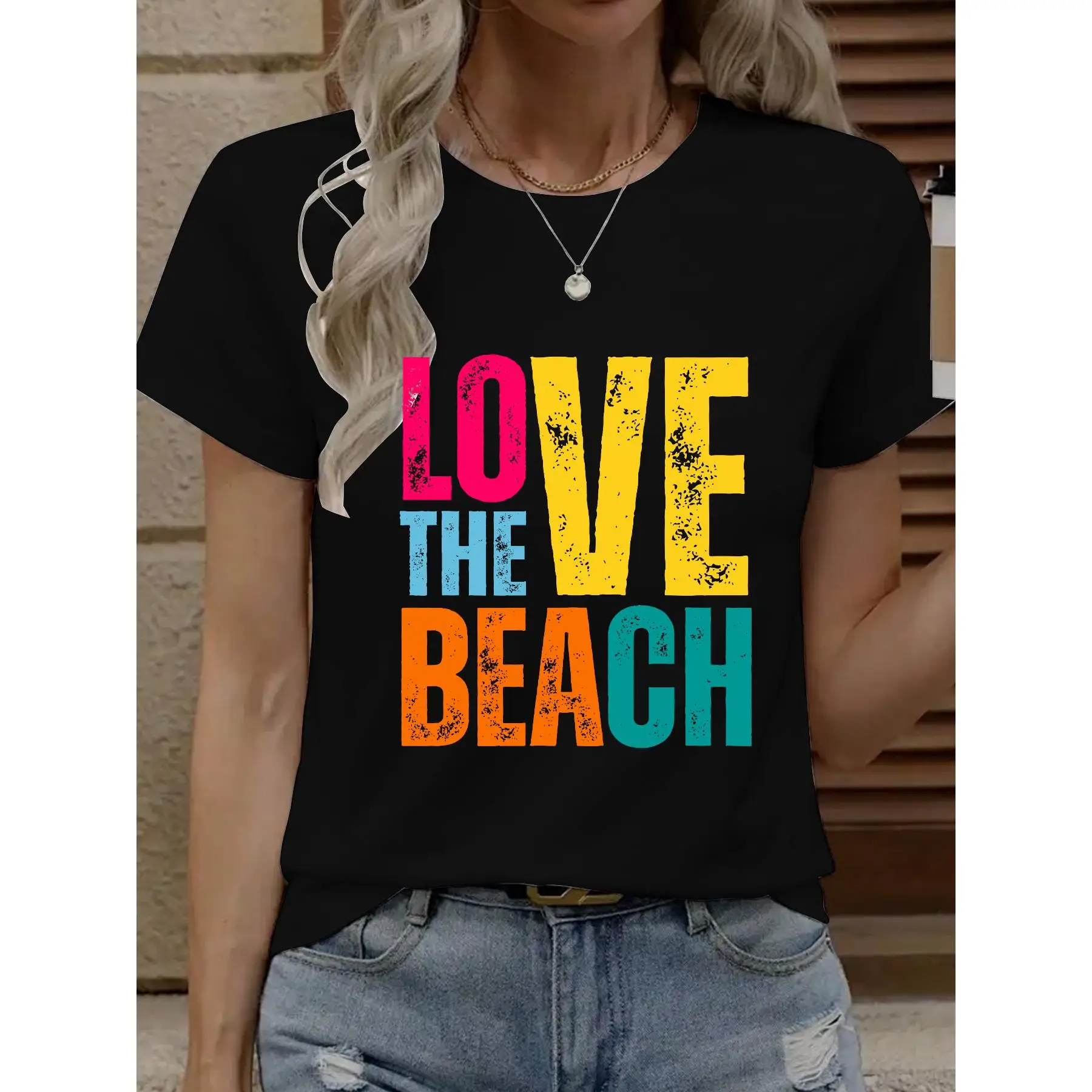 

T - Shirt With “LOVE THE BEACH” In Colorful, Distressed Letters, Perfect For Beach Enthusiasts.