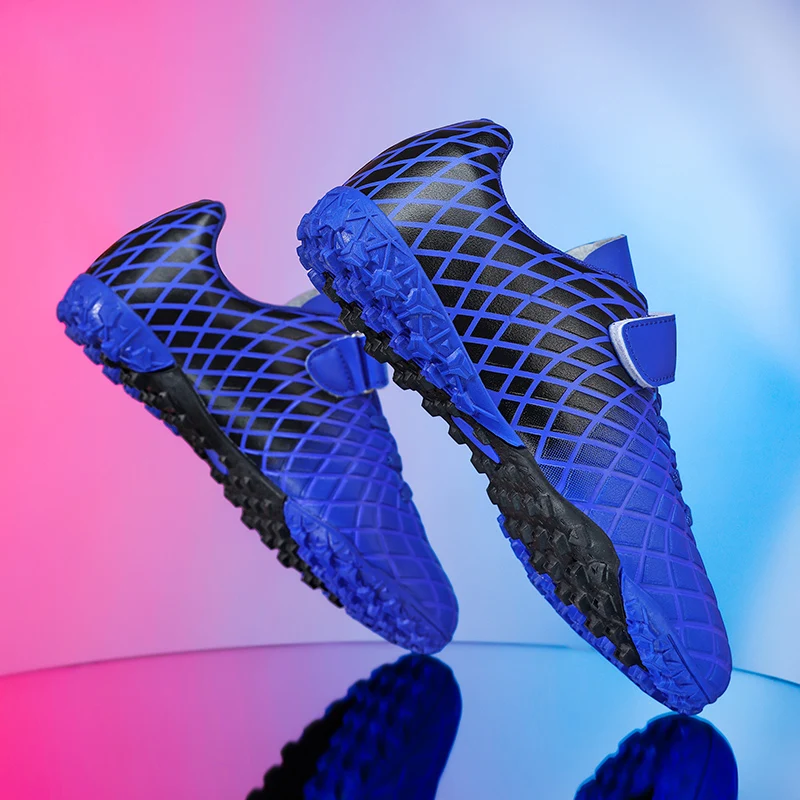 A pair of children's turf soccer shoes, hook‑and‑loop design, anti‑slip short studs for lawn training