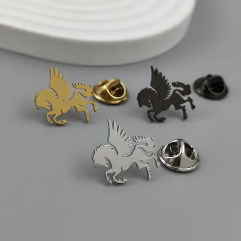 Metal Pegasus brooch. A winged horse made of stainless steel, a universal badge or emblem, an exquisite and compact gift.