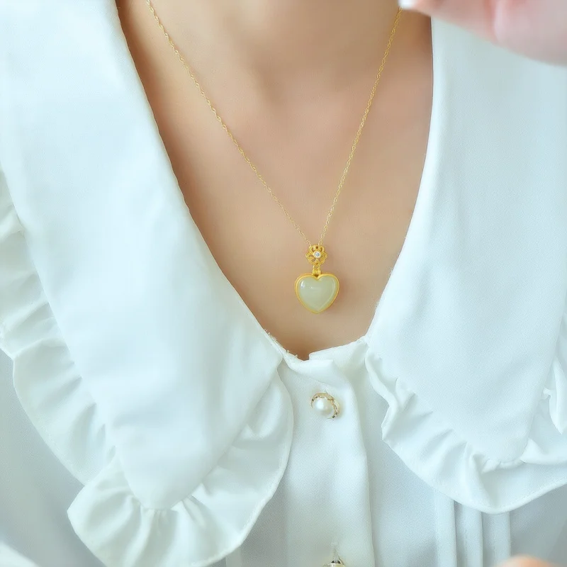 Hetian على شكل قلب طبل S925 الكيس المجوف اليشم قلادة قلادة