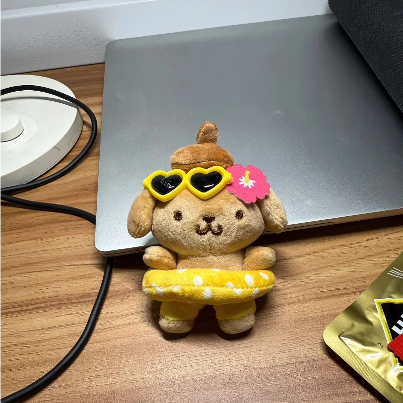 Zwart lederen zwemringen Pudding Hond Poppen Leuke cartoonanimatie Perifere knuffels Rugzakken Pluche hangers Meisjescadeau