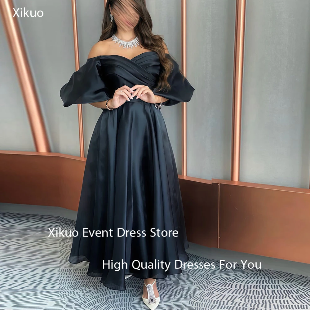 فستان سهرة أنيق من الأورجانزا باللون الأسود من Xikuo في المملكة العربية السعودية بدون حمالات رداء حفلات بأكمام منتفخة على شكل حرف A فساتين المشاهير حسب الطلب