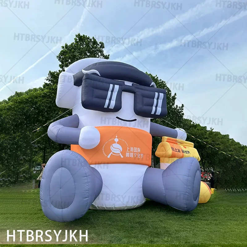 

Inflatable coffee doll, sitting on grass with headphones, outdoor/grass activities display decorative drainage promotional props