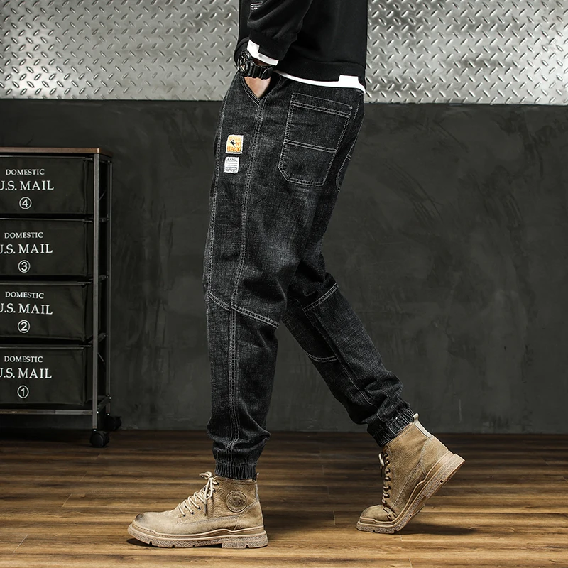 رجل في الهواء الطلق البضائع نمط مدبب الدينيم الجينز 2025 الخريف الشتاء الرباط مكبل تصميم سراويل تقليدية حجم كبير 5XL #3