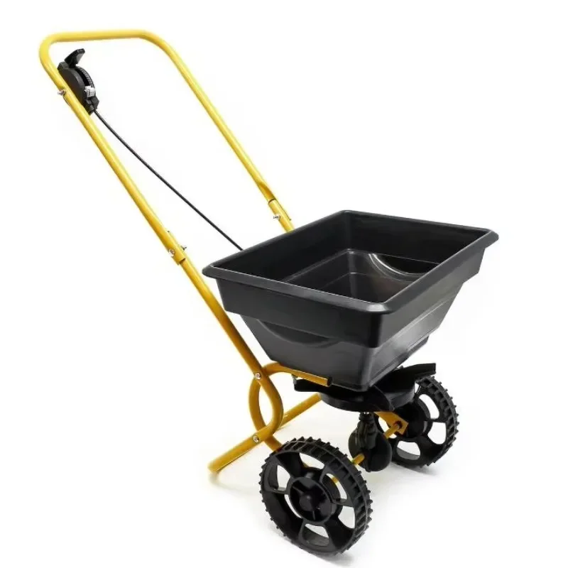 Towed behind the broadcast compost spreader with extended easy-to-reach handle