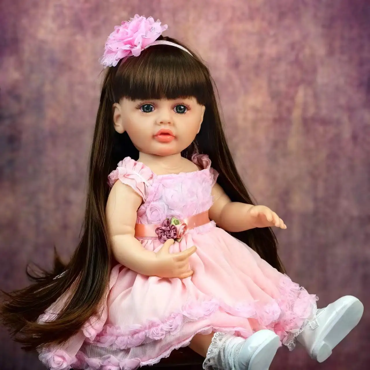 Lifelike 22 - Inch Reborn Baby Doll in Adorable Pink Outfit with Floral Decoration - Perfect for Gifting and Snuggling