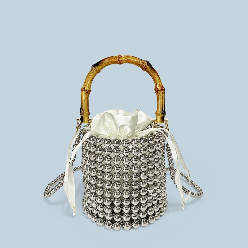 

New niche design drawstring bucket bag, pearl chain bag, hand-held bamboo bag, hand woven crossbody bag