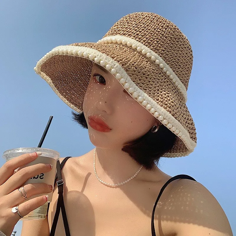 A thin woven hat for women providing shade by the seaside on surrounded fisherman and cool