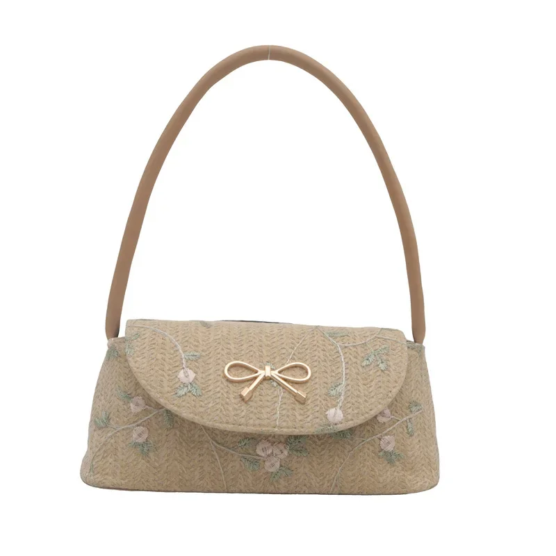 Korean version of fashionable versatile straw woven bag women's high-end bow thorn shoulder embroidered armpit bag