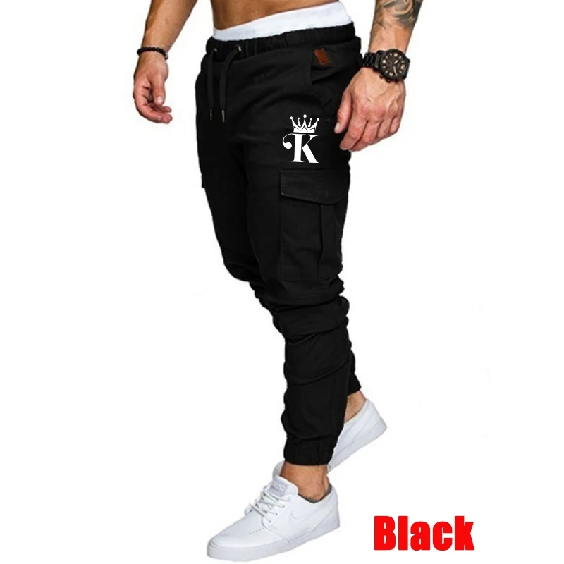 Pantalones Cargo holgados con múltiples bolsillos y cordón para hombre, ropa de calle informal con cintura elástica, pantalones holgados de Color sólido para otoño 2024