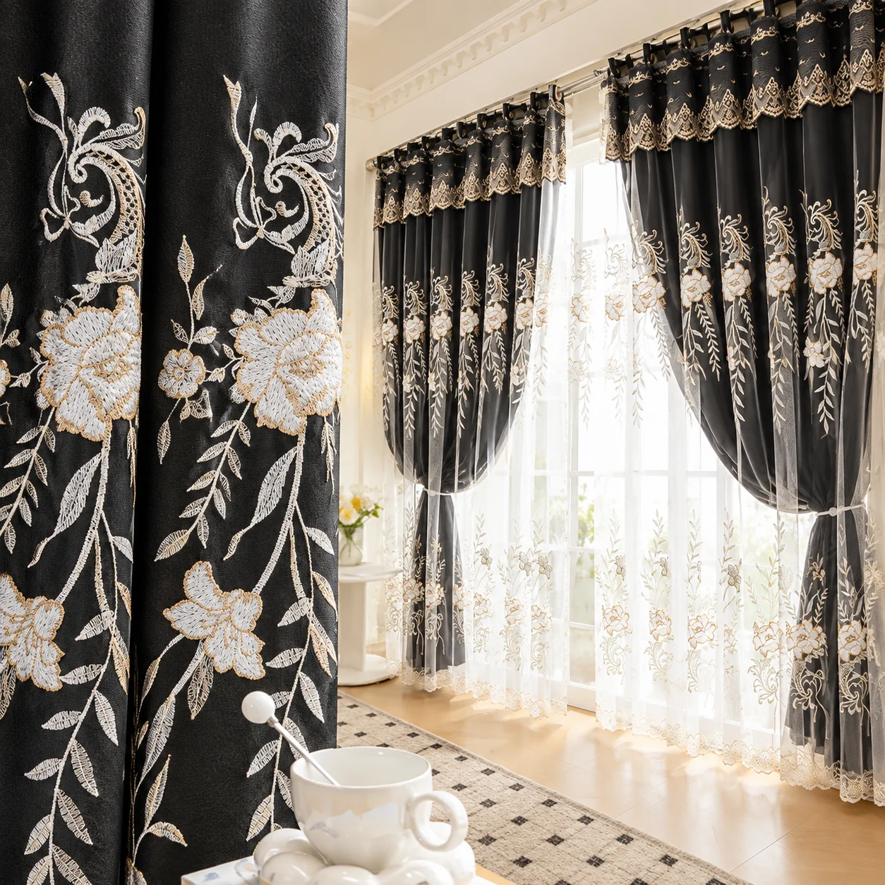 Two-piece black embroidered blackout curtains with white floral lace lining, featuring a double-color layered grommet top, ideal for living rooms and bedrooms, offering modern and elegant decor