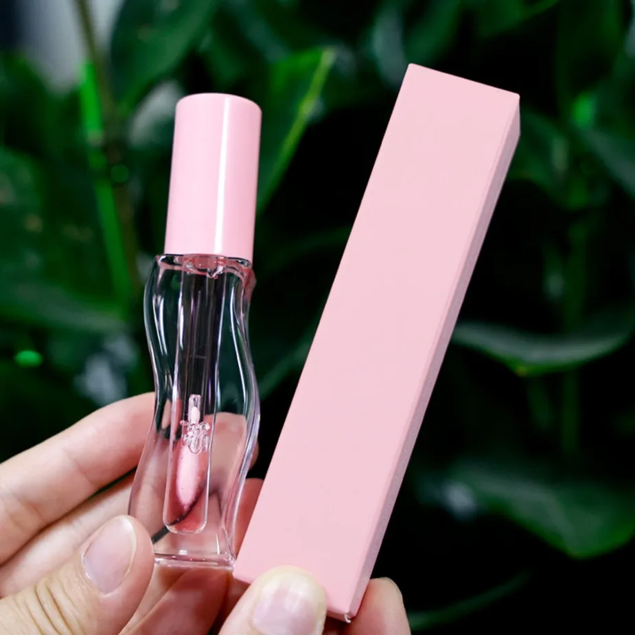 Gros marque privée maquillage végétalien Logo personnalisé huile pour les lèvres fruitée repulpante conception ondulée brillant hydratant brillant Non collant brillant à lèvres