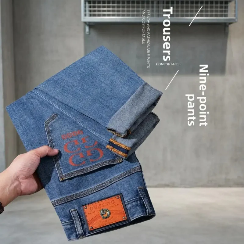 Luxury Style Blue Denim Jeans for Men, Straight Cut, Casual Pants with Orange Print & Contrast Leather Tag Design, Suitable for