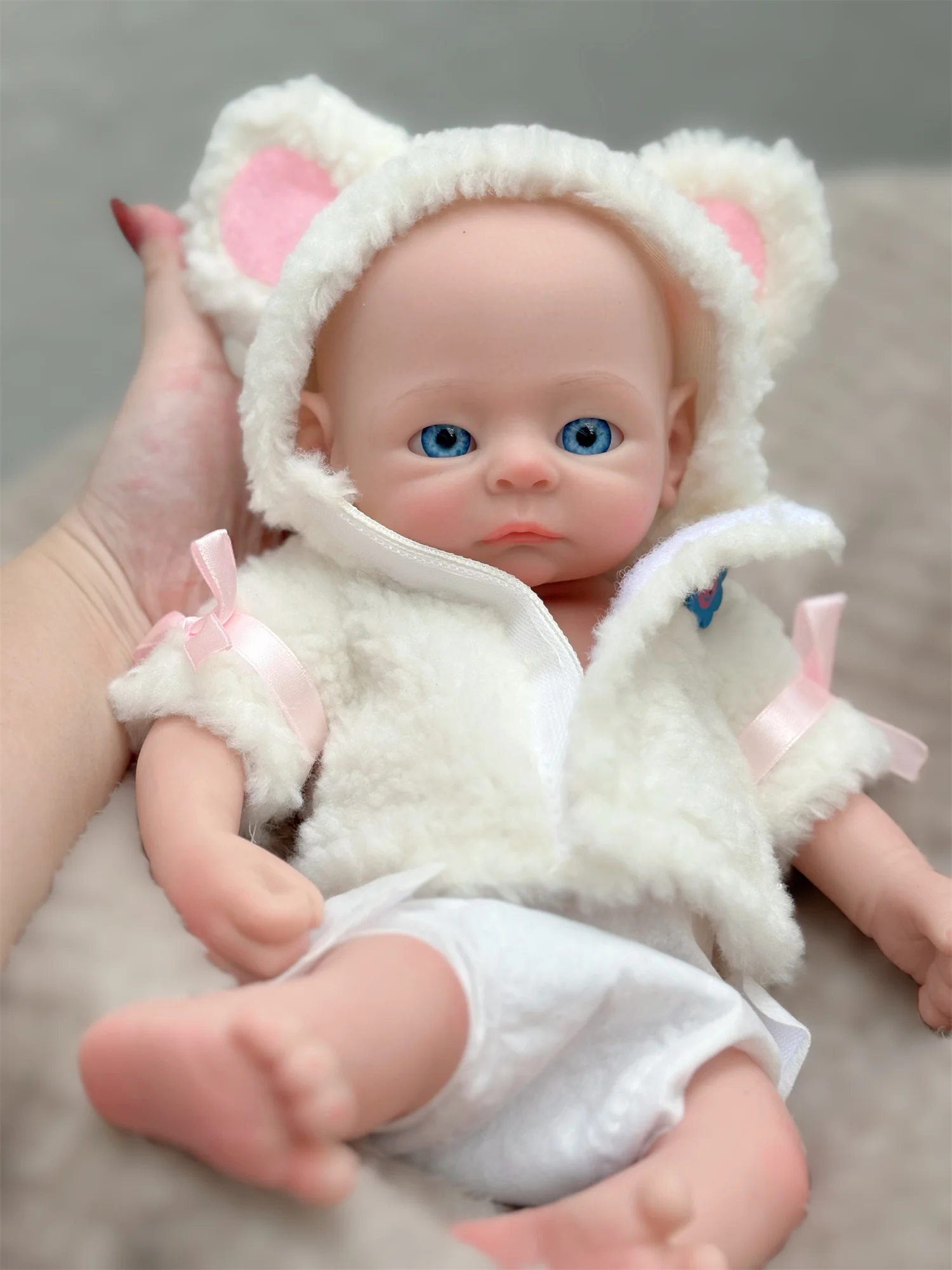 13Inch Open Eyes Full Body Solid Silicone Girl Doll Wear A Furry Coat With Painted Bald 3D Painted Skin Flexible Bebe Reborn