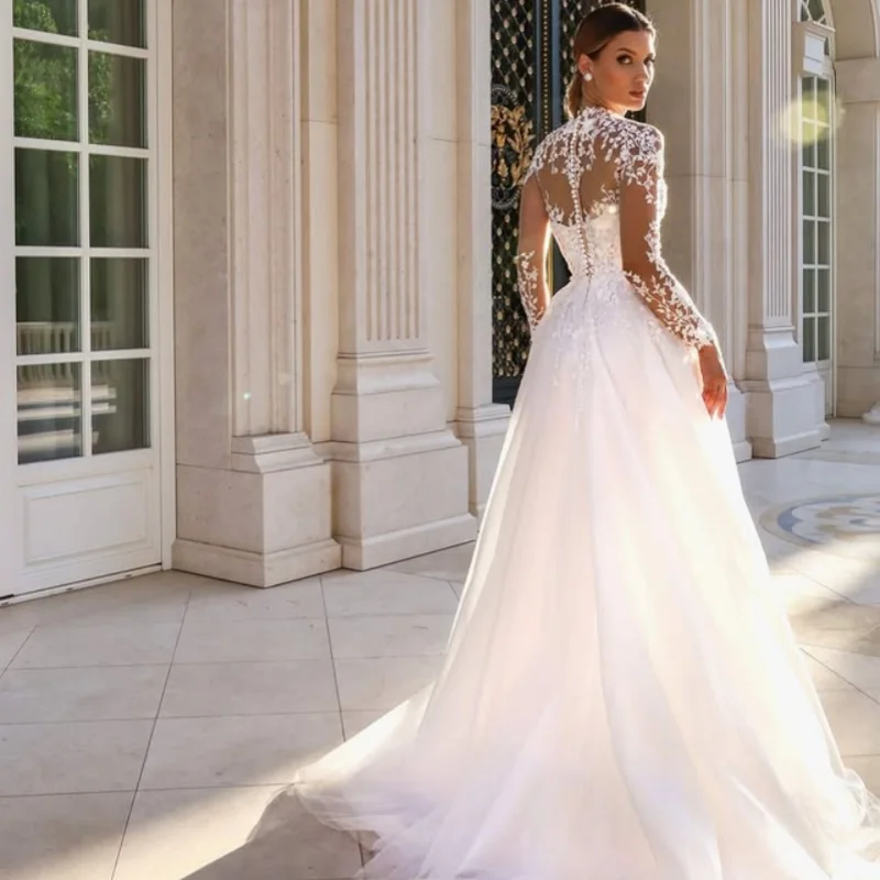 ชุดแต่งงานทรงบอลกาวน์สีขาวแบบกำหนดเอง ชุดแต่งงานแบบราชวงศ์ หางยาว แต่งลูกไม้ทรงหางปลา ผ้าทูลแขนยาว ชุดแต่งงาน