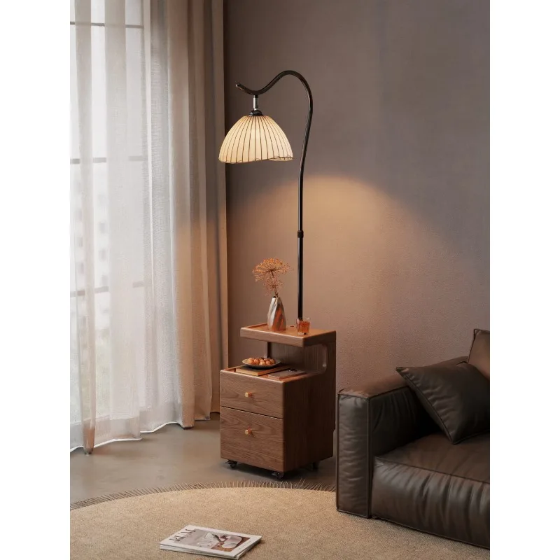 several floor lamp shelves next to the sofa, antique solid wood side cabinets in the integrated living room, and bedside tables.