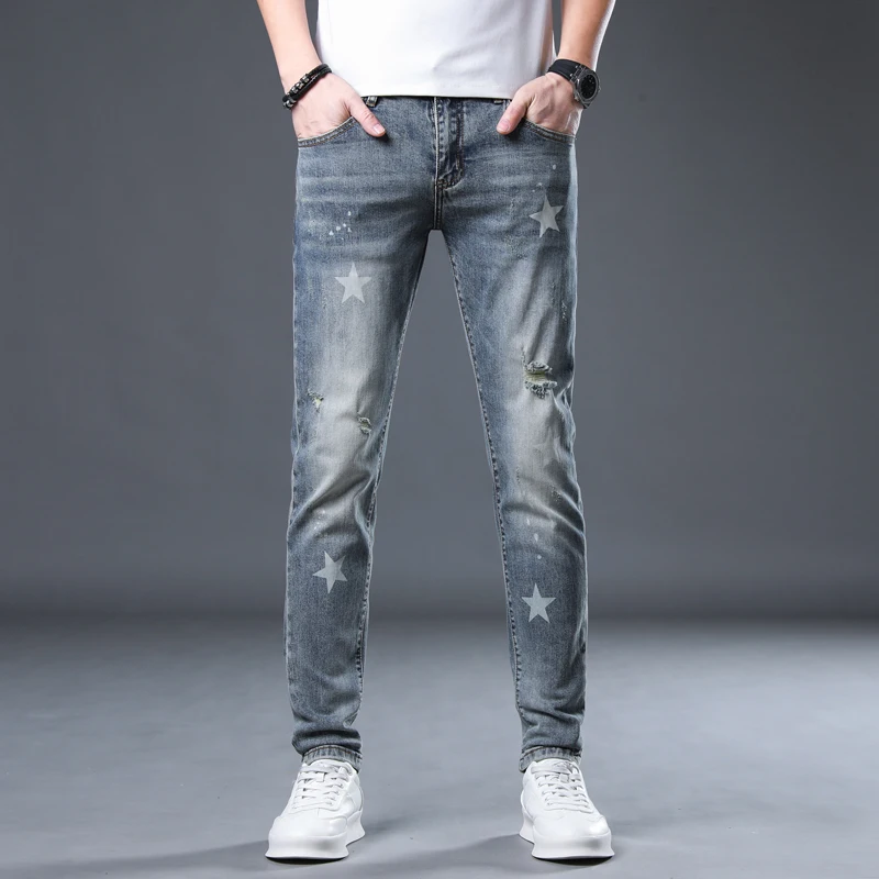 High quality light colored perforated jeans for men's fashion 2024 new spring and autumn men's slim fit small feet ripped jeans