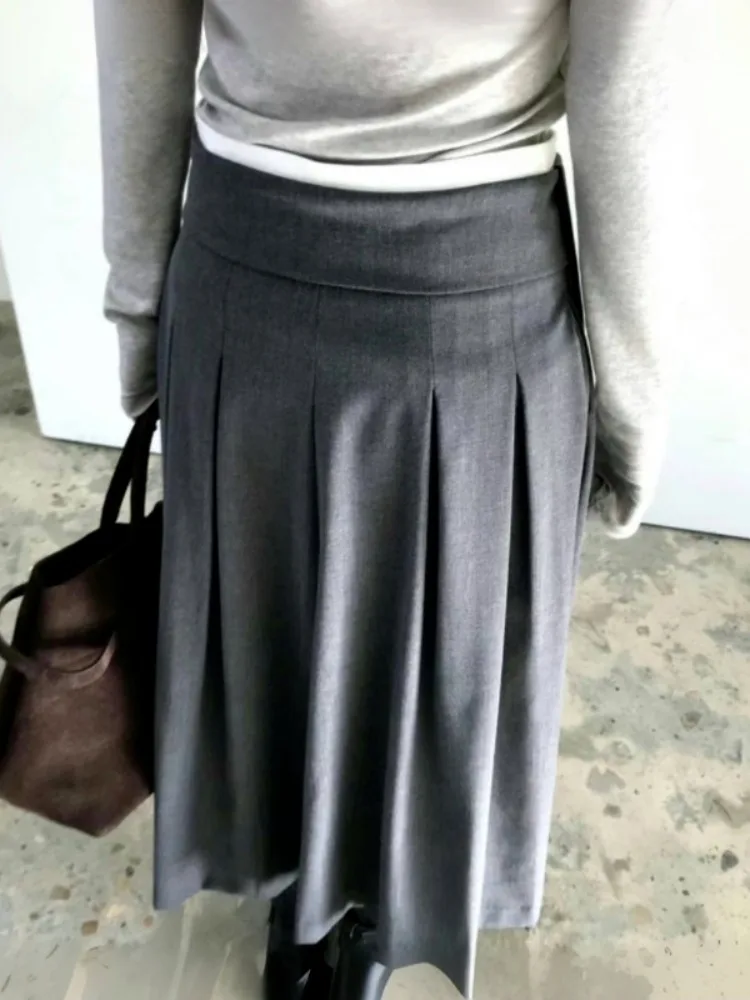 

Шикарная плиссированная юбка трапециевидной формы для весеннего колледжа, универсальный асимметричный подол, простой дизайн, весенне-осенний гардероб...