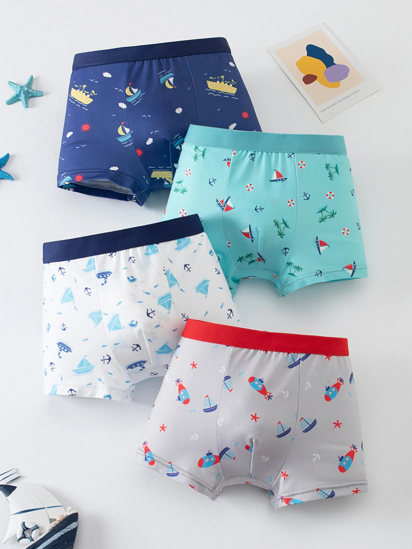 4-piece set of comfortable and versatile cartoon underwear for boys in all seasons, including boxy shorts and home casual shorts