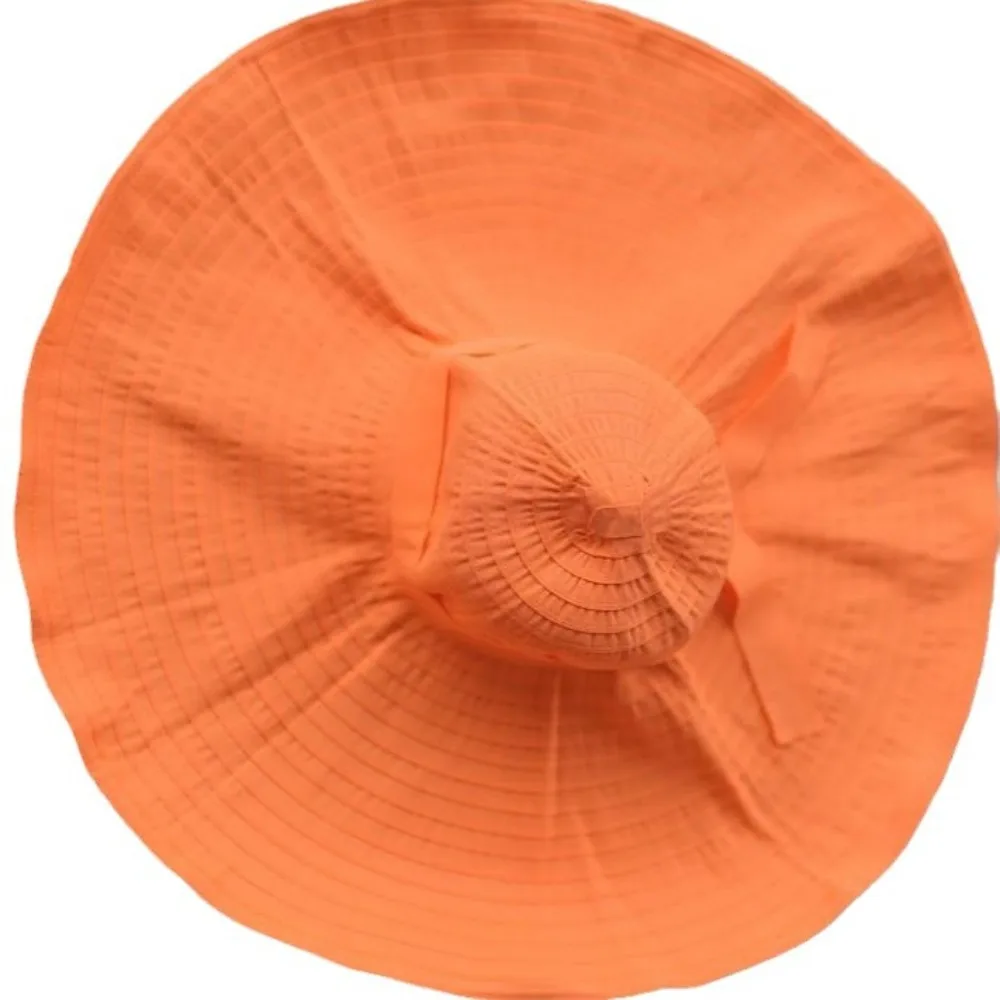 قبعة قابلة للتعبئة بعقدة على شكل فيونكة قابلة للتشكيل ذات حافة واسعة واقية من الشمس وقابلة للطي من البلاستيك قبعة دلو للأشعة فوق البنفسجية ومضادة للتنفس للنساء قبعة الشمس للشاطئ