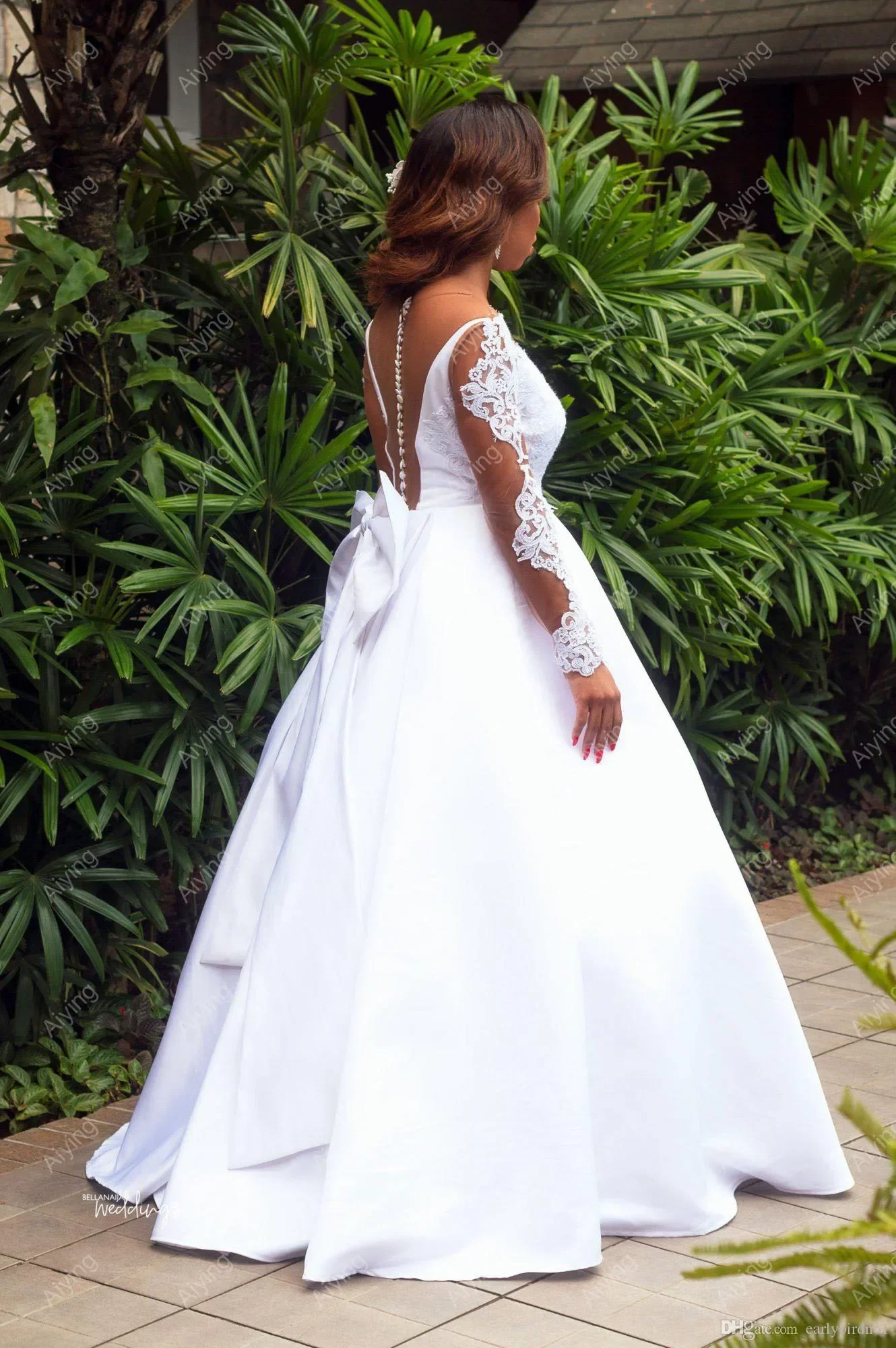 Maßgeschneiderte Spitzenapplikationen A-Linie Brautkleid Hofzug Vestido De Noiva Illusion Lange Ärmel Afrikanisches Brautkleid mit großer Schleife