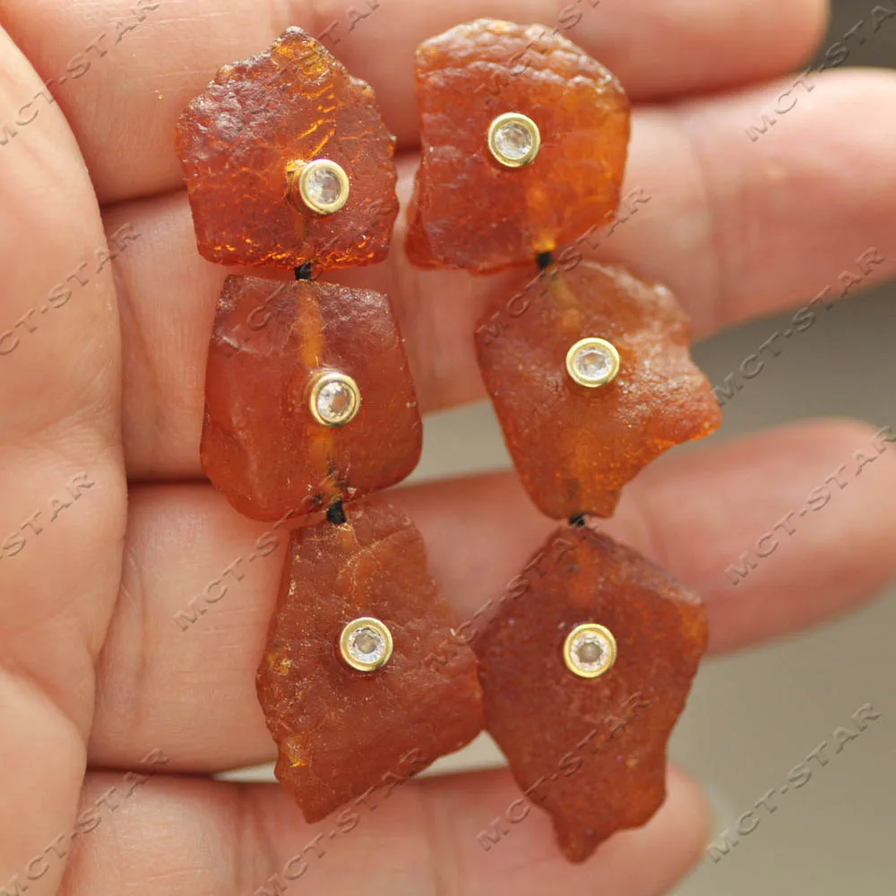 

Z14433 3Row 21mm Baroque Lamina Natural Orange-red Pine Resin Amber CZ Dangle Earring