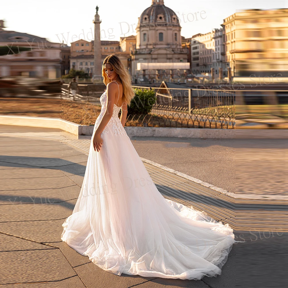 Fascynujące damskie suknie ślubne z linii aplikacje koronkowe suknie panny młodej seksowne paski Spaghetti z boku wysoko rozcięty Vestido De Novias