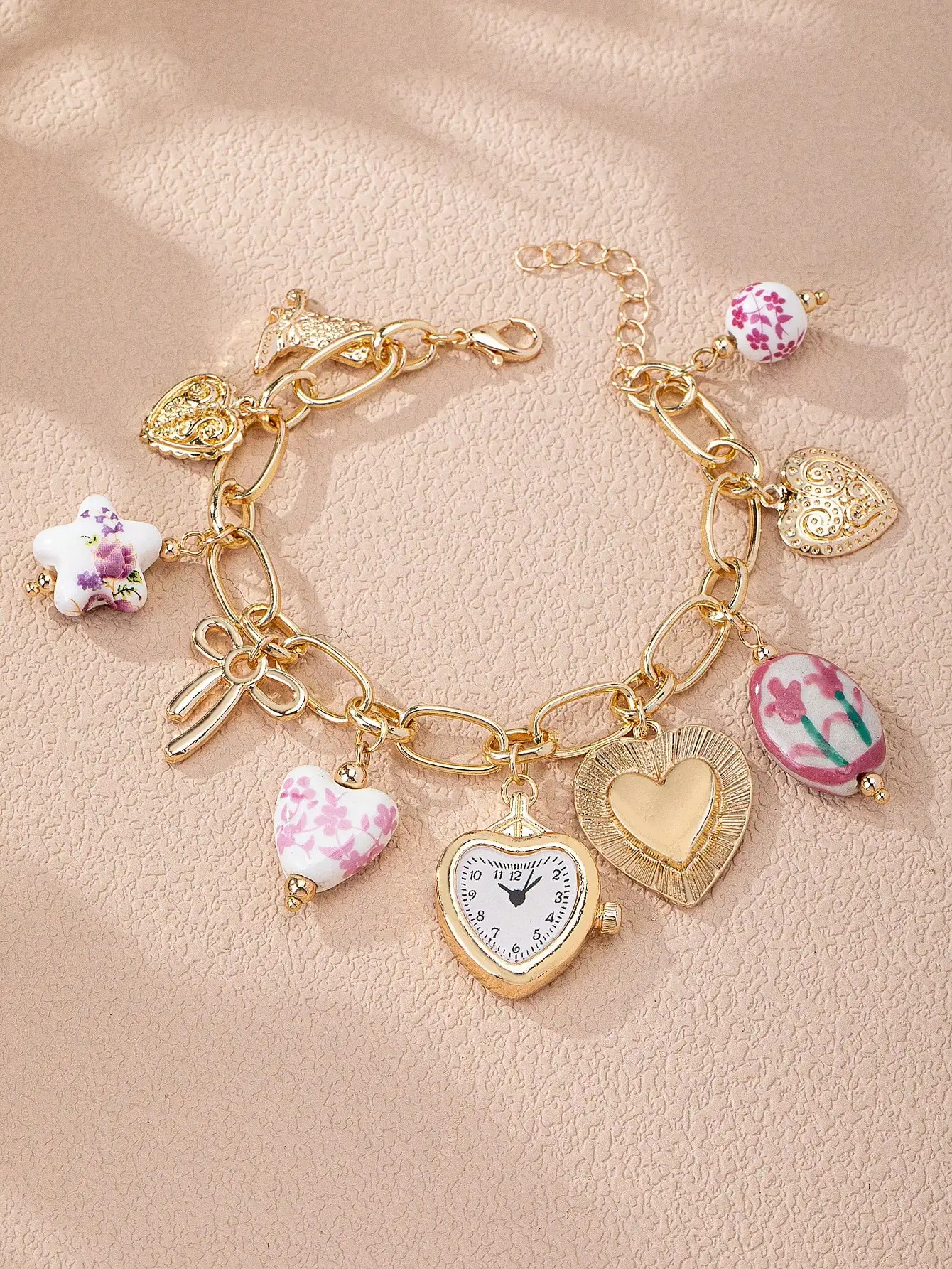 

Gold-Tone Charm Bracelet with Floral Ceramic Hearts, Faux Watch & Bow Pendant