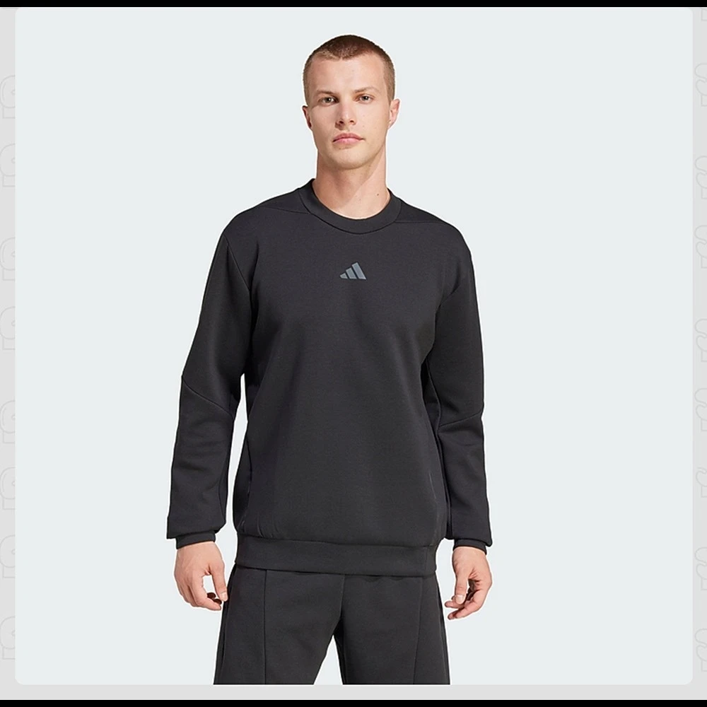 Adidas Men's Black Crew - Neck Sweatshirt: Made with soft, breathable fabric. Features the iconic Adidas logo on the chest. Clas