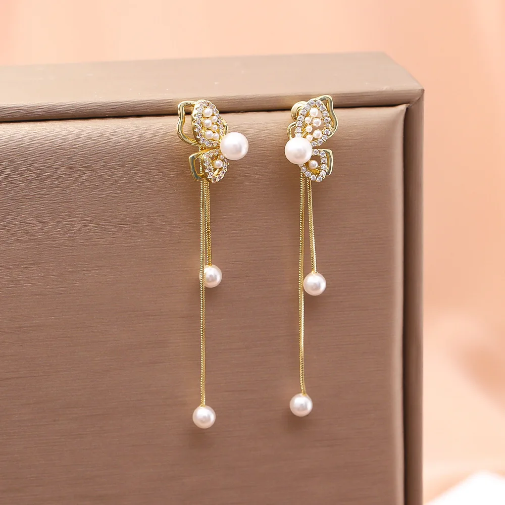 

Fashionable and exquisite niche design long tassel earrings high-end zircon pearl butterfly earrings feminine earrings