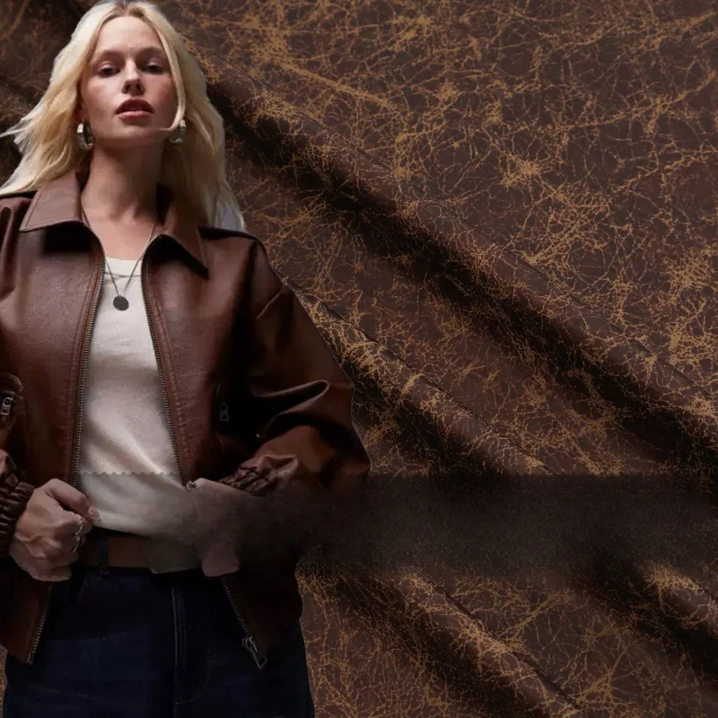 

Vintage drapey chocolate brown cracked marble texture printed faux suede fabric for trench coatsB