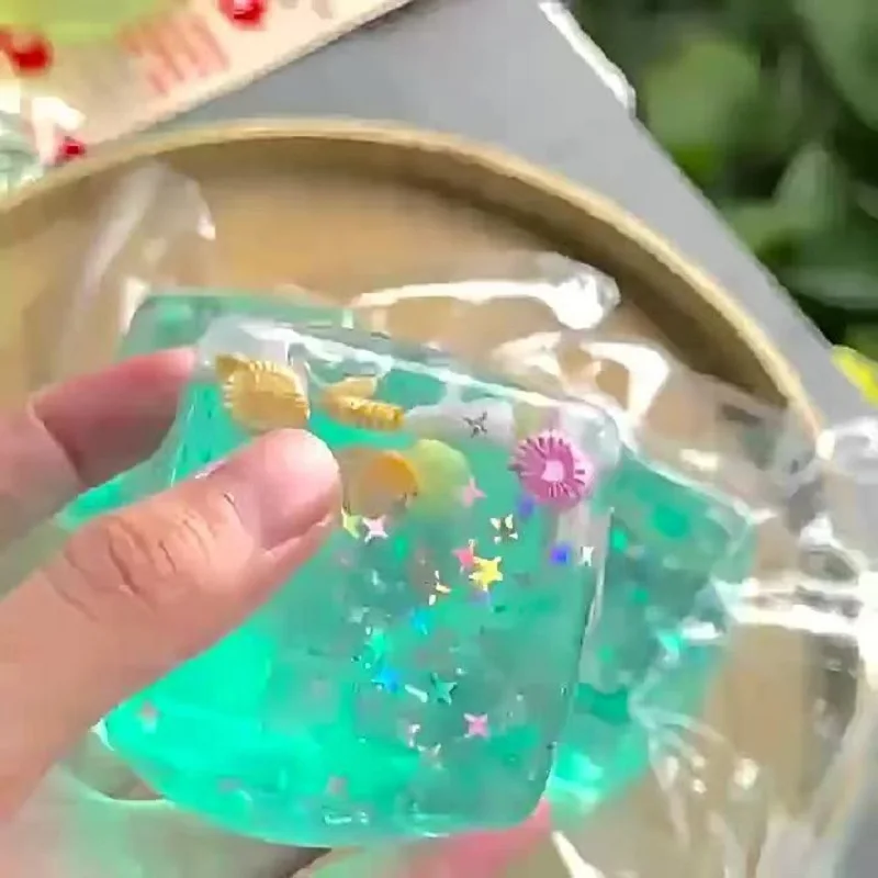 Letnia zabawka antystresowa w kształcie kostki lodu z motywem wyspy i muszelek, idealna na biurko dla dzieci i dorosłych, nie roztapia się, można ją ściskać.