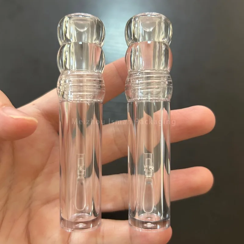 50 szt. Nowe, całkowicie przezroczyste butelki na błyszczyk w kształcie tykwy o pojemności 3 ml, okrągłe opakowania do makijażu, przezroczyste plastikowe tubki na błyszczyk z płaskim pędzelkiem.