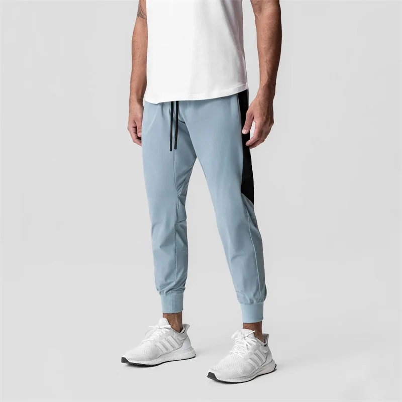 

2025 Summer fitness Training long pants Men's pure color Casual skintight jogging trousers Men Breathable Quick-Dry sweatpants