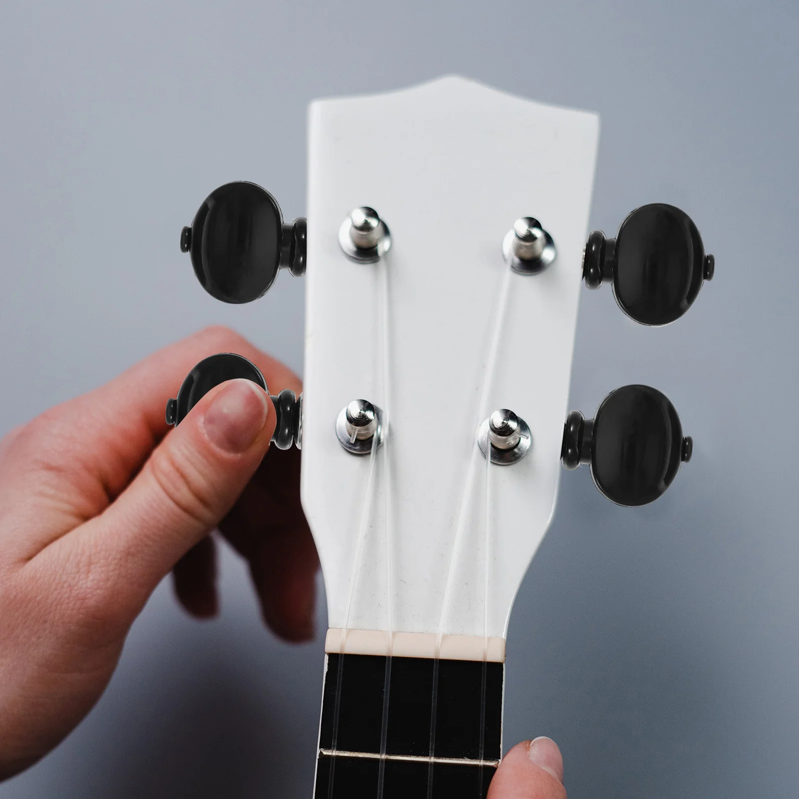 

4Pcs White Ukulele Tuning Machines Steel Shaft Plastic Button Adjustable Tension Key Tuner for String Instruments Friction