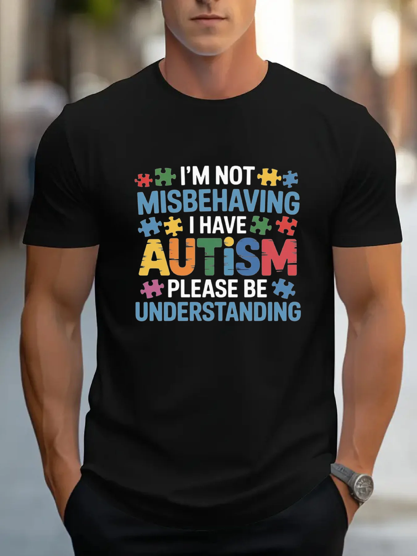 

A black men's round-neck T-shirt with an autism awareness puzzle pattern and text: "I'm not causing trouble.