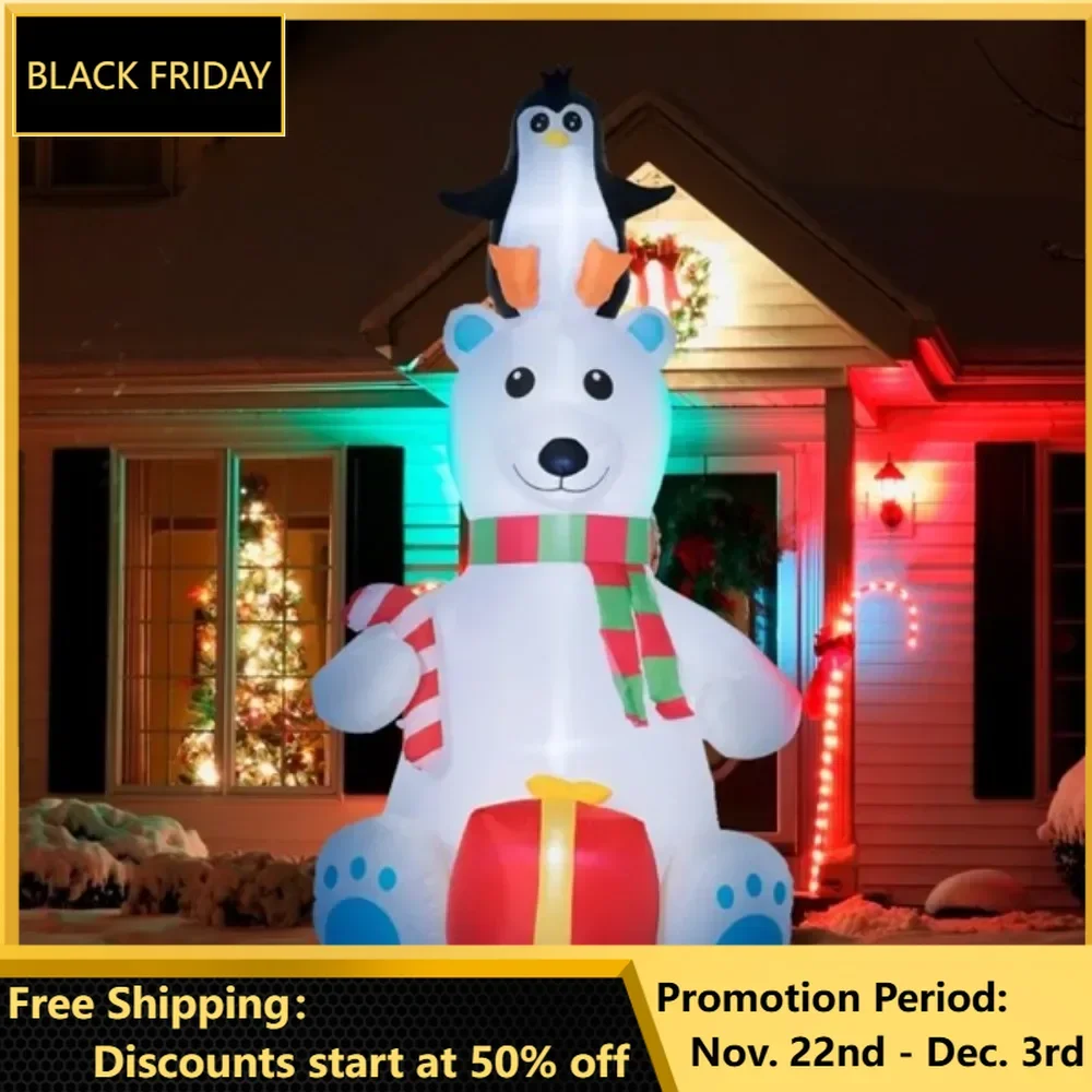 Christmas polar bear with a penguin on its head cane candy and an inflatable gift box put together a cohesive Christmas display