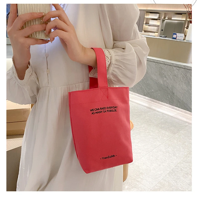 2023 New Minimalist Style Mini Portable Canvas Bag Lunch Bag for Women Handbag Candy Color Kettle Wrist Strap Plain Canvas Bag