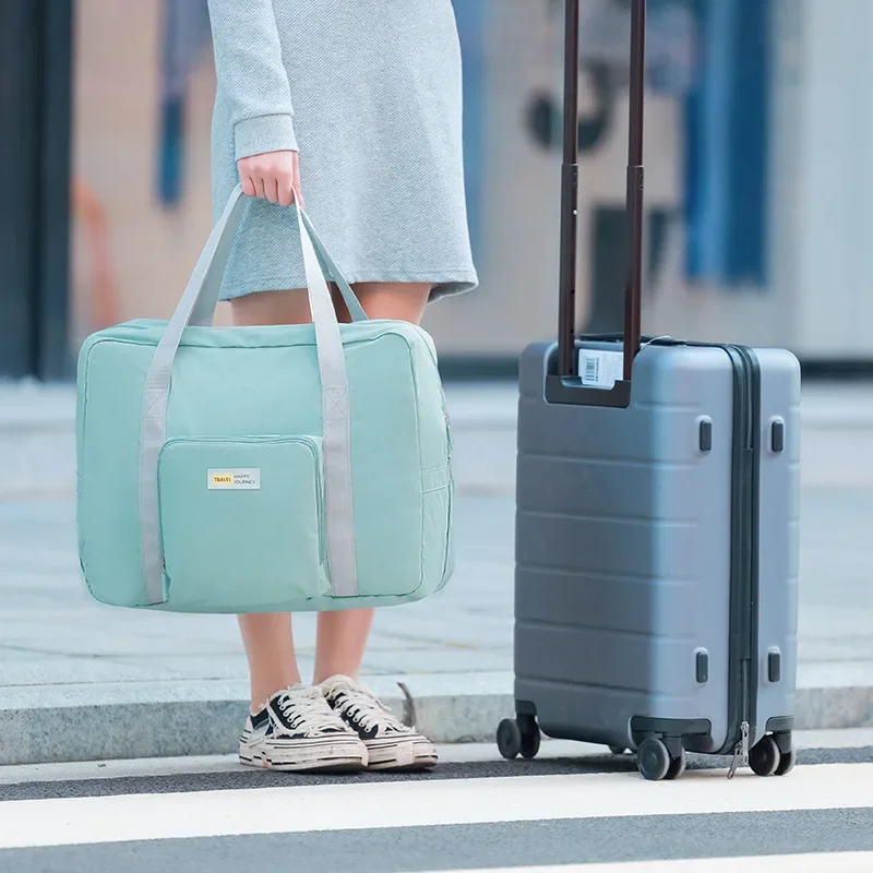 Borsa da viaggio pieghevole grande borsa da viaggio impermeabile per vestiti da fine settimana borsa a mano per bagagli cosmetici messa su Trolley da uomo