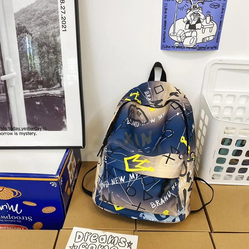 Men Women Graffiti Print Nylon Backpack With Plush Pendant Lightweight Multi Pocket Casual School Travel Rucksack