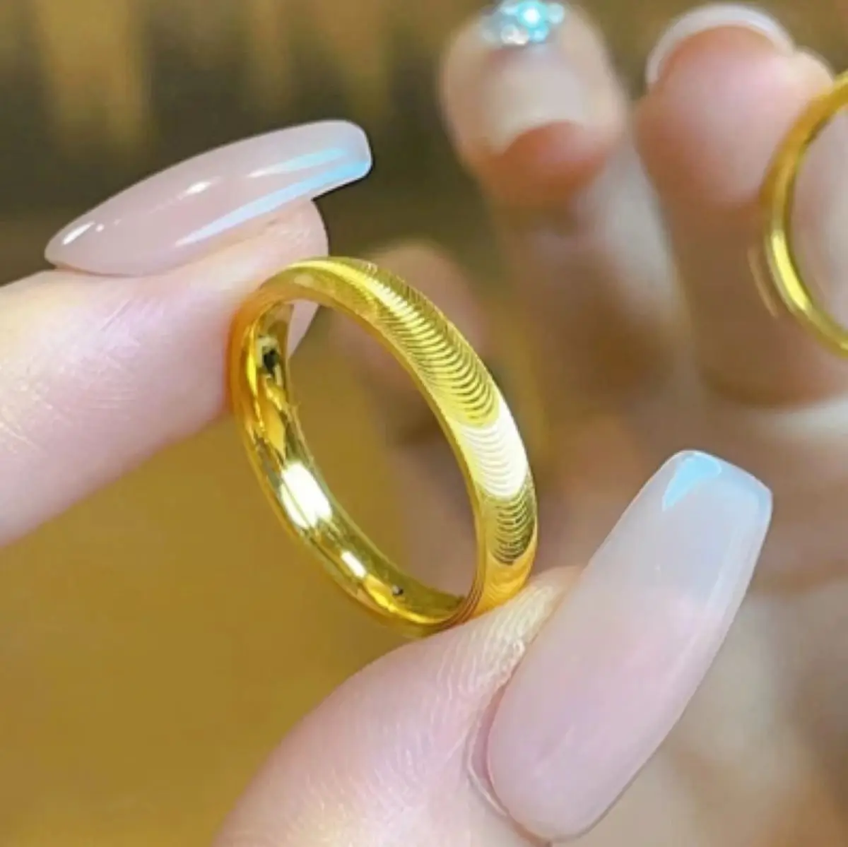 Titanium steel plain band with cat eye effect and wavy geometric texture electroplated in gold or steel tone unisex fresh natura