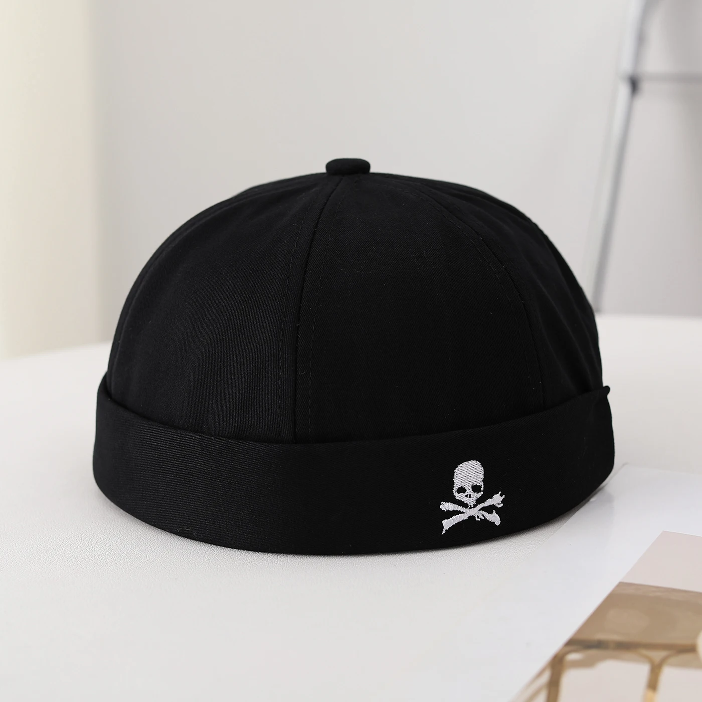 Japanese-style straw cap with no brim, a domed top, suitable