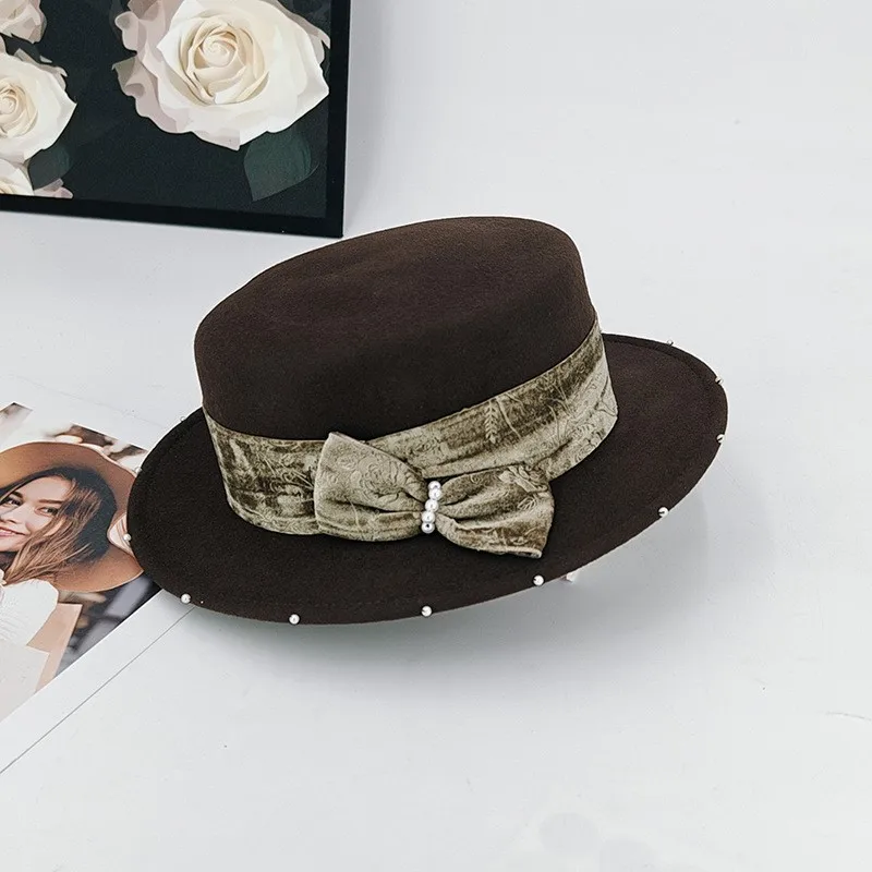

A lady's elegant flat-topped hat with printed velvet