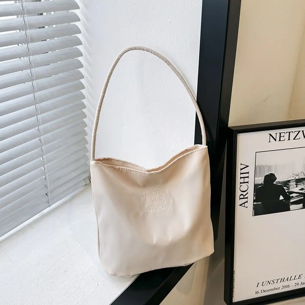 

Korean Style Letter Underarm Bag Handbag Pure Color Embroidery Shoulder Bag Large Capacity Tote Bag Nylon Bucket Bag Women