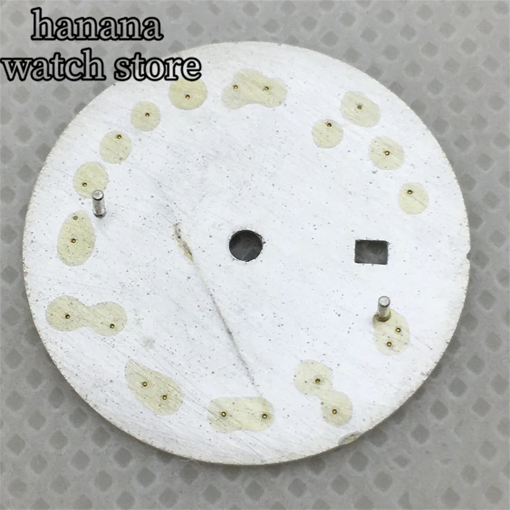 قرص NH05 للسيدات مقاس 24.5 ملم باللون الأسود والذهبي والوردي ومينا للتعرض اليومي باللون الأبيض اللامع مع مؤشر روماني يدوي مناسب لحركة NH05