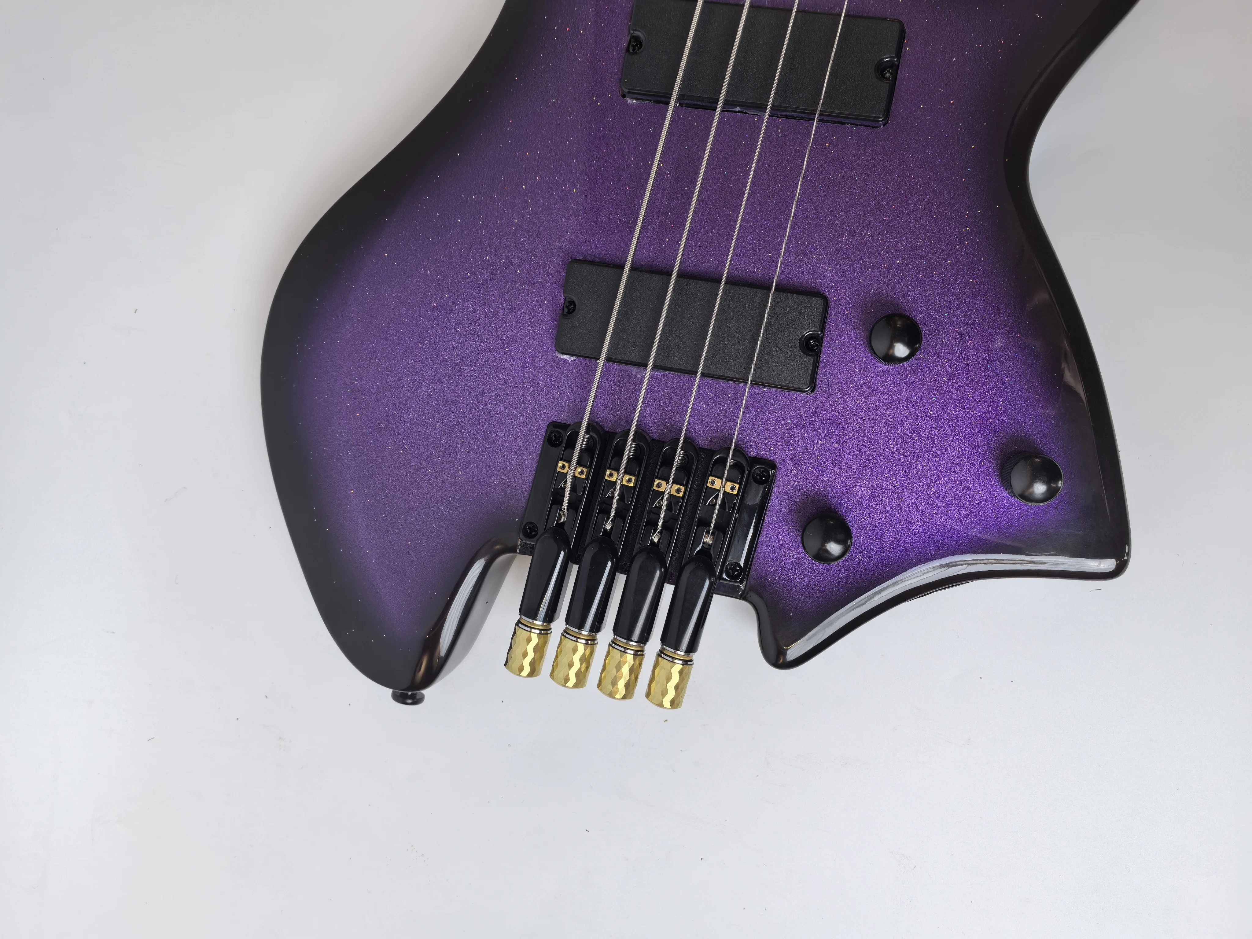 

Factory direct sale, African rosewood, 24-tone headless electric guitar, round head tone wire, Purple big granules。