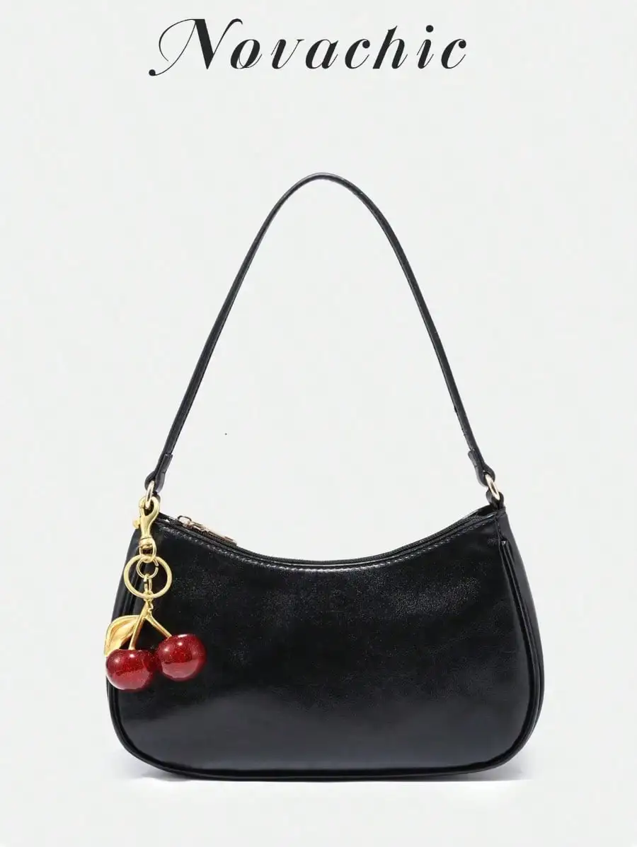 

Black Glossy Leather Saddle Bag with Cherry Charm Pendant, Zipper Closure, One-Shoulder Design