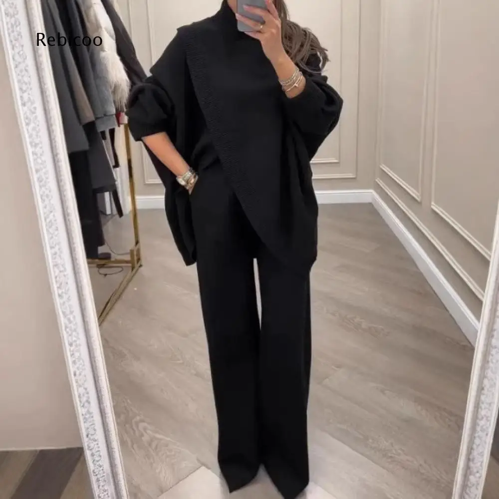 Conjunto de punto holgado para mujer: top de cuello alto con mangas de murciélago, chal tipo capa y pantalones de pierna ancha para looks urbanos y de oficina.