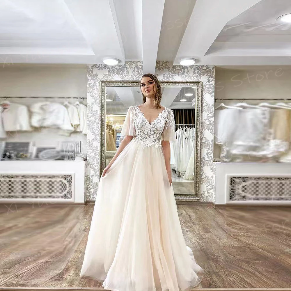 2025 Romantico A Line Abiti da sposa per le donne Appliques in pizzo Abiti da sposa Affascinante scollo a V manica corta Tulle Vestido De Novia