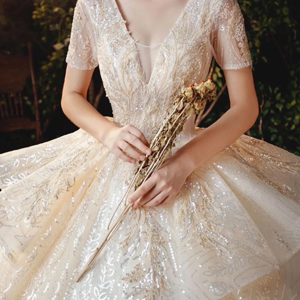 Luxe Lvory/blanc encolure dégagée manches courtes à lacets robes de mariée 2025 longueur de plancher balayage Train Organza paillettes robe de mariée